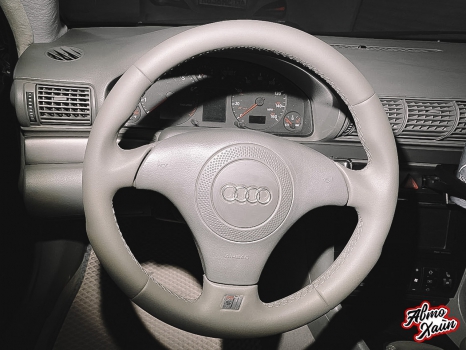 Audi A4. Перетяжка передних сидений, руля и подлокотника_2